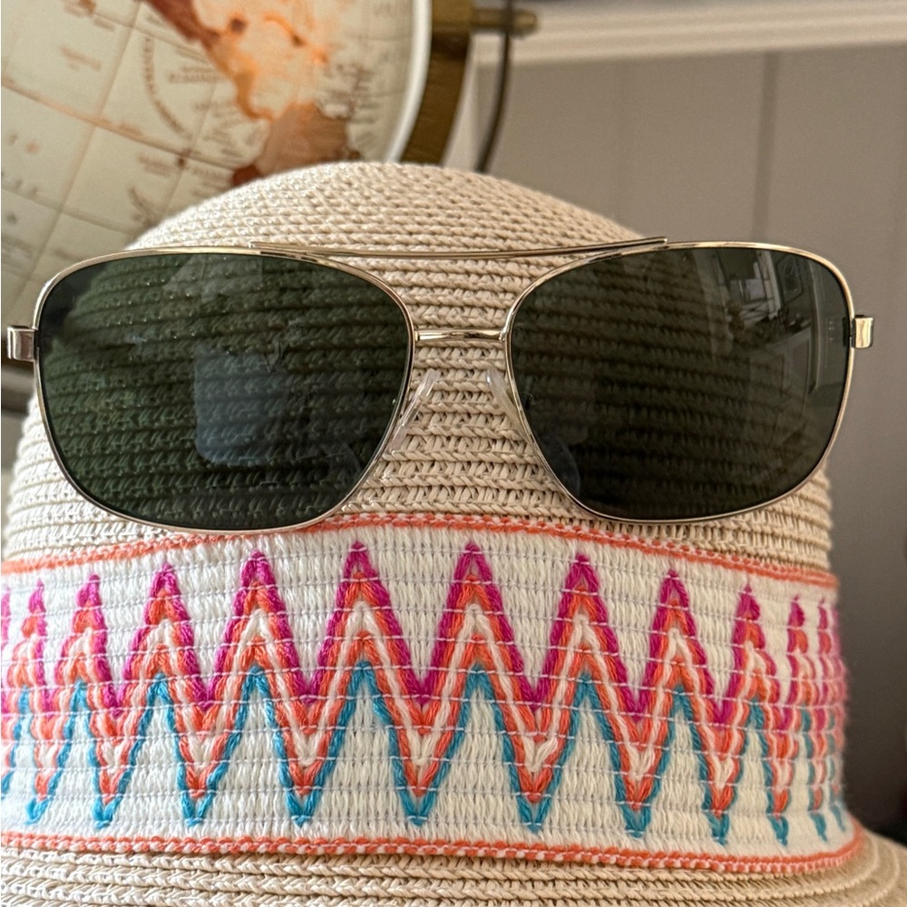 Stylish Chaps Aviator Sunglasses comes with a black, sturdy zippered case.